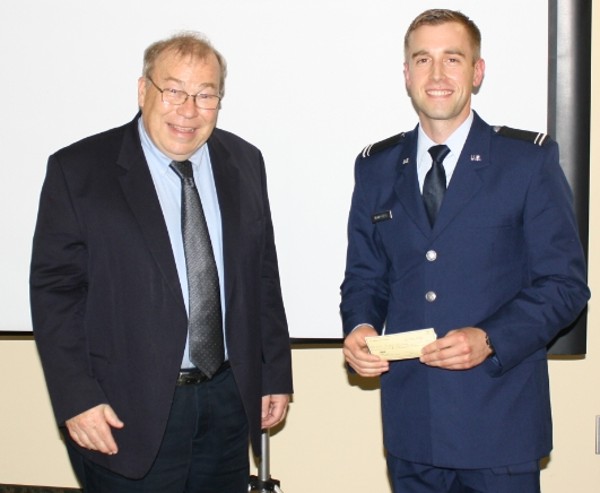 In May, Francis Mazzocchi, chapter vice president for scholarships (l) presents the 2014 Scholarship to Cadet Peter Holloway, USAF.