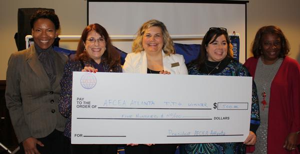 Chapter President Col. Kathy Swacina, USA (Ret.) (2nd from l), and Michelle Brown, education vice president (r), present Teaching Tool Grants in January to (from l) Maria Brown of Washington Park Elementary School; Sheila Harmony of Coleman Middle School; and Kimberly Hutcheson of Baker Elementary School. 