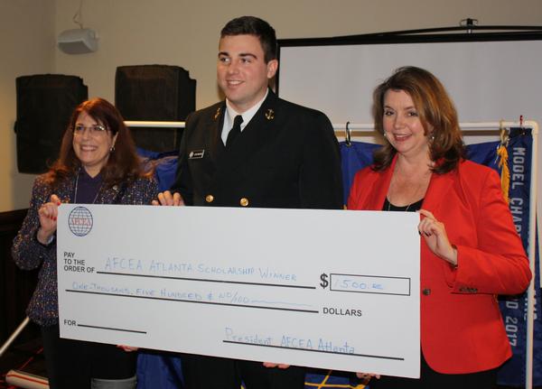 Chapter President Col. Kathy Swacina, USA (Ret.) (l), and Julie Goetz, vice president, scholarships, present this year's Chapter Education Scholarship in January to Georgia Tech senior and Naval ROTC Cadet Jacob Lochmann.