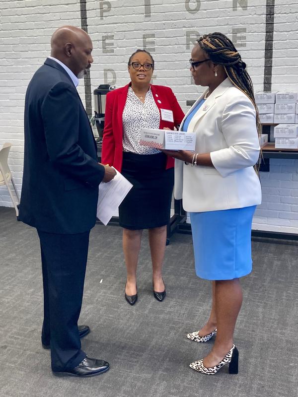 In July, following her keynote discussion, Tracey Grace (r) talks with Chapter Secretary D'Joane McCorkle (c) and Richard Brooks about what it's like to be a small business in Atlanta.