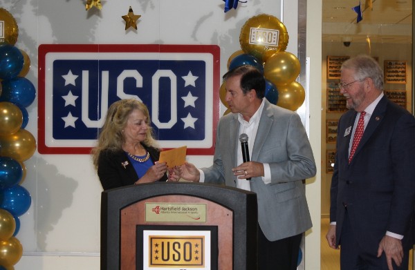 Mary Lou Austin, president of the USO of Georgia, (l) receives a grant from Chapter President David Landry (c) while Maj. Gen. Tom Wessels, chairman, USO (r) looks on at the USO 75th anniversary event in February. 
