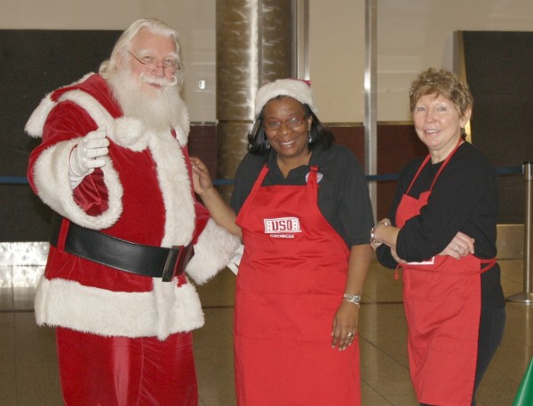 Waiting for Fort Gordon troops to arrive in December are (l-r) Santa, Michelle Brown and Kathy Whitlock.