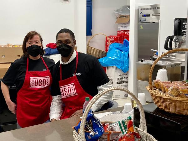 At the December event, Stacy Vaughn and Lawrence Williams are looking fresh as they start their shift of prepping hot dogs and refilling the cooler.