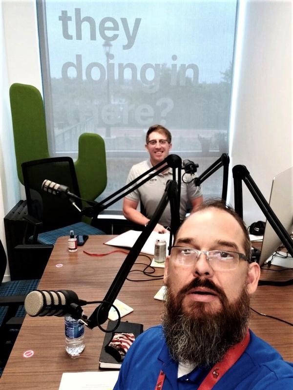 In September, Doug St. Amand, Young AFCEAN representative, moderates Cyber 30903, while seated in the Georgia Cyber Center Podcast Studio with Tom Barnes, vice president of Parsons, in the foreground.