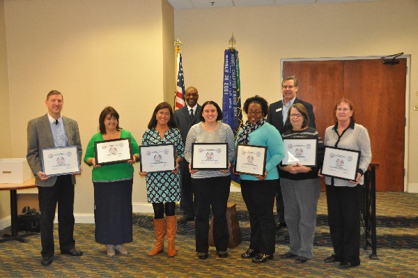 Chapter grant recipients recognized in January are (front row, l-r) Michael Stone accepting for his wife, Vanessa, Milbrook Elementary; Esther Blake, Chukker Creek Elementary; Julie Newman, Riverside Elementary; Amy Edwards, Mossy Creek Elementary; Robin Rogers, Jefferson Elementary; Charlotte Smith, Lakeside High School; and Debbie Murphy, River Ridge Elementary. Horace Carney (back row, l), chapter scholarship chair, and Bob Damen, chapter president, assist with the presentation.