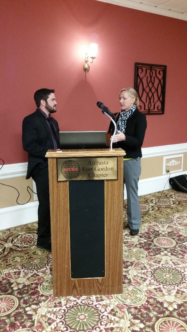 Guest speaker Aaron Dellamano, senior penetration tester of TECHGUARD Security, continues to converse with Carrie McLeish after a fantastic presentation on continuous network monitoring at the Lunch and Learn in March.