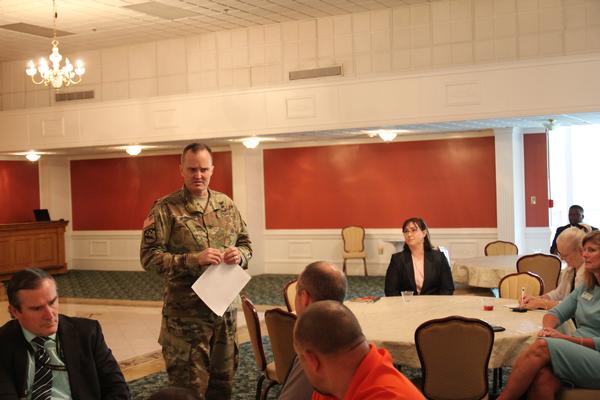 At the August luncheon, Col. Dan Mettling, USA, commander, 116th Military Intelligence Brigade, discusses his unit's mission and requirements and takes questions from the audience.