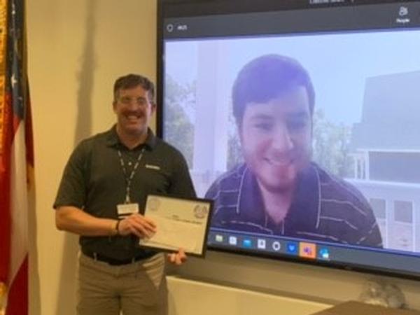 Chris Krautheim receives a STEM scholarship at the June event.