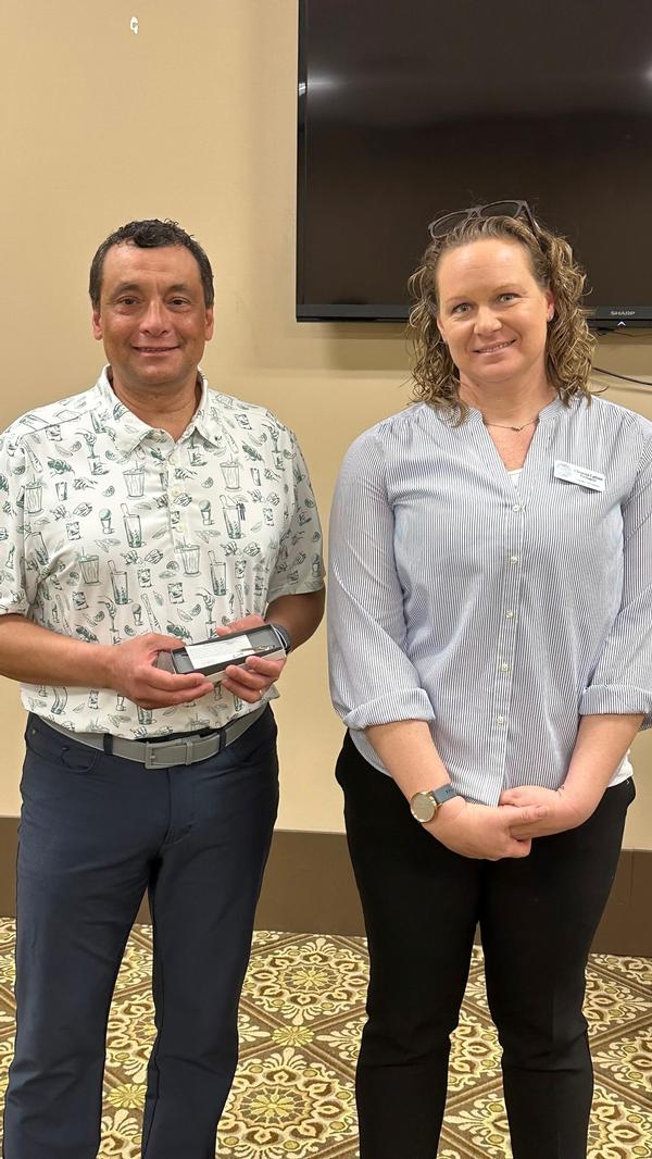 Christina Purkapile, chair of the chapter's programs, presents Robert Coccaro, series guest speaker, with a gift of appreciation. Coccaro presented a great update on how to protect your identity and data while surfing the internet.