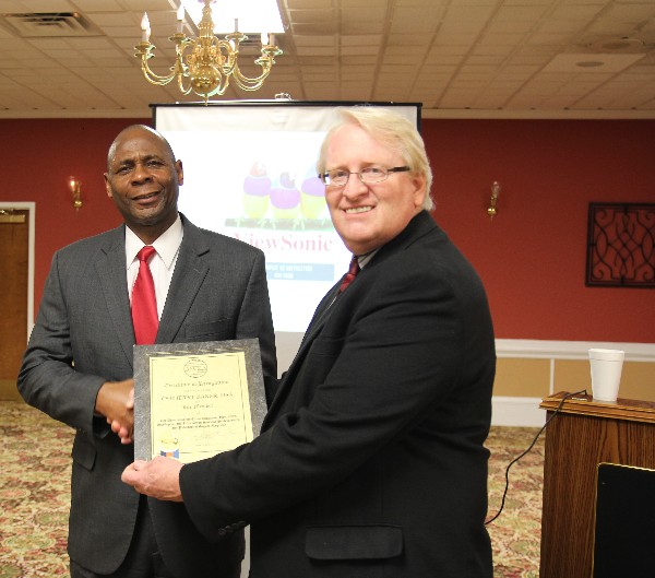 Cmd. Sgt. Maj. Jerry Baker (l), USA (Ret.), Department of Labor, receives his Life Member certificate from Chapter President Brian Coffey at the chapter's luncheon in February.  