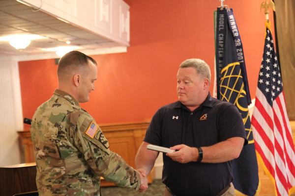 Jeff Williams (r), chapter programs director, presents Col. Mettling, with an appreciation gift at the luncheon in August.   