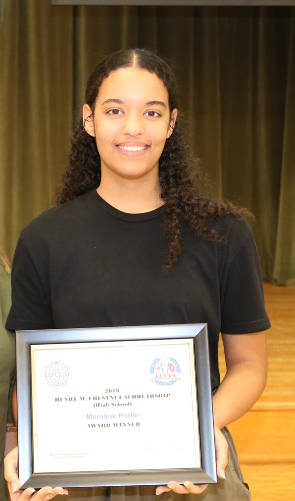 Monique Porter, Davidson Fine Arts School, Augusta, Georgia, receives one of the chapter's Chestnut Family Foundation Scholarship Awards during the July ceremony.