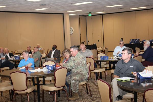 In September, chapter members listen eagerly to timeline information about the new entrance to the Cyber Center of Excellence. 