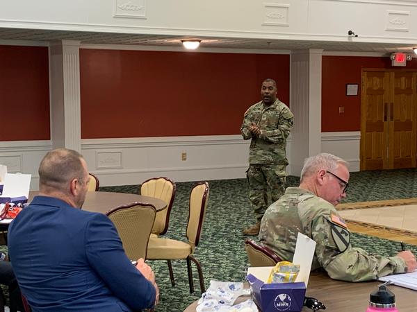 CW5 Brian Matthews briefs the method of training cyber career skills in the U.S. Army at the October meeting.