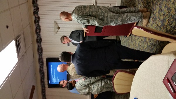 At the October Lunch and Learn, Bruce (c) interacts with attendees.
