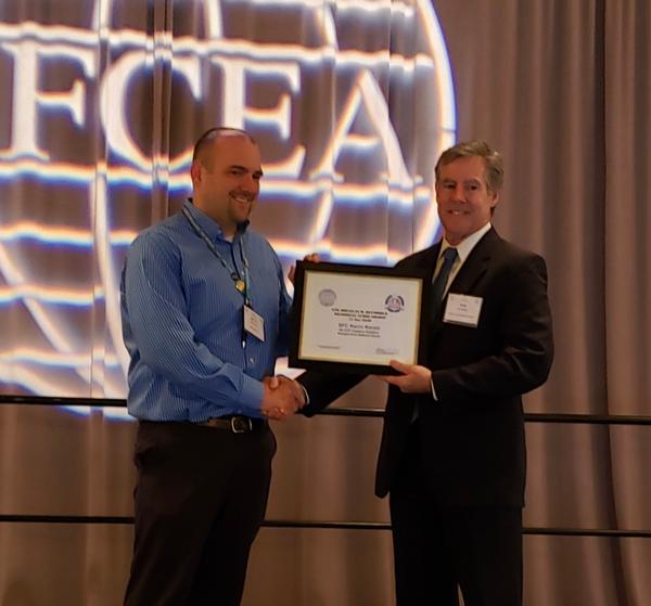 Sgt. First Class Kevin Kinzer, ANG, receives the Lt. Gen. Douglas Buchholz Scholarship from Bob Damen, past chapter president, during CERTS in January. 