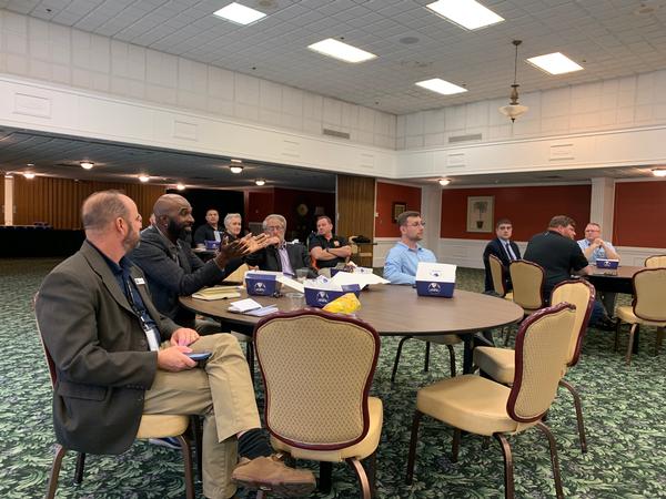 Attendees actively participate in an extended Question and Answer period during the October event.