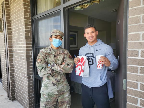 In May, Staff Sgt. Kristian Hoffman-Martinez, USAF, chapter vice president of membership, spreads the news about AFCEA as he passes over a delicious lunch. 