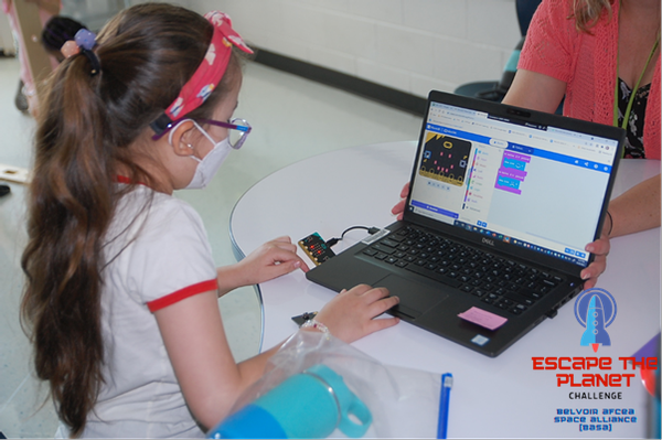 Students at Fort Belvoir Upper School in Fort Belvoir, Virginia, familiarize themselves with Microbit devices that will be used in the Escape the Planet hackathon in December.
