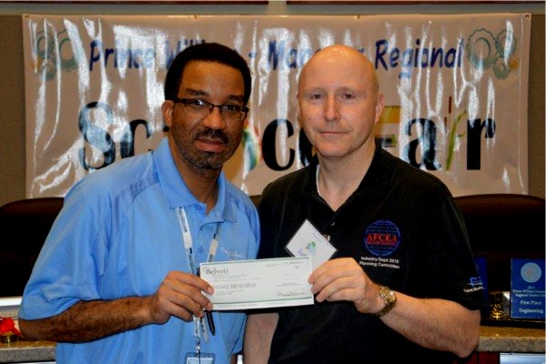 Bill Jones (r), chapter president, joins Jason Calhoun, Ph.D., supervisor of science and family life education for Prince William County Schools, during the science fair in March. 