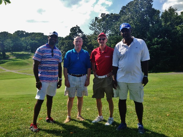 Team Belvoir stops for a group photo on the 18th hole during the AFCEA Belvoir Education Golf Tournament in June.