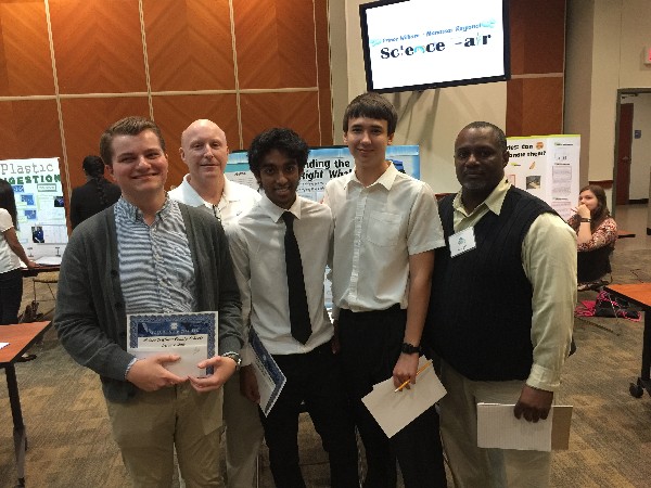 Chapter President Bill Jones (second from l) and Education Vice President Reginald Vaughn (r) stop for a photo with winners at the Prince William County (PWC) Science Fair, which the chapter supported in March.