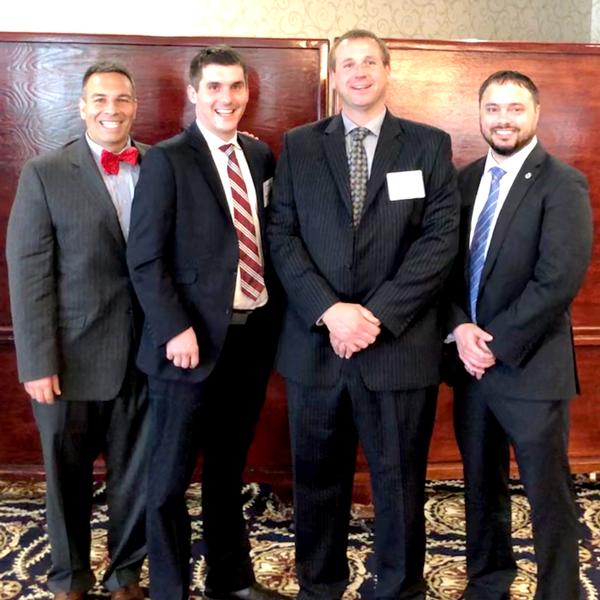 Eric Strauss, chapter vice president, small business, poses with (l-r) Michael Yacobacci, division chief, IT Services, Defense Logistics Agency (DLA) Contracting Services Office–Philadelphia (DCSO-P); John Fafara, division chief, Strategic Programs, DCSO-P; and Chris Hall, deputy director, DLA Office of Small Business Programs of DLA  at the May event held at Fort Belvoir Officer's Club.