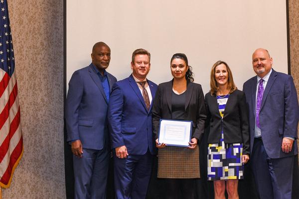 The Kevin Carroll Scholarship for Excellence is awarded to Melina K. Chapula Gutierrez at the June event. Photo by Elizabeth Moon