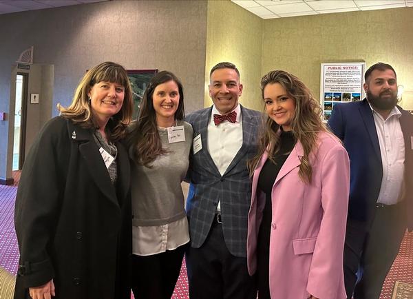 Chapter Emerging Leader Elizabeth Moon (far r) and chapter officers and board members Lyndsey Hoe and Mollie Pearson (far left) pause for a photo at the February event.