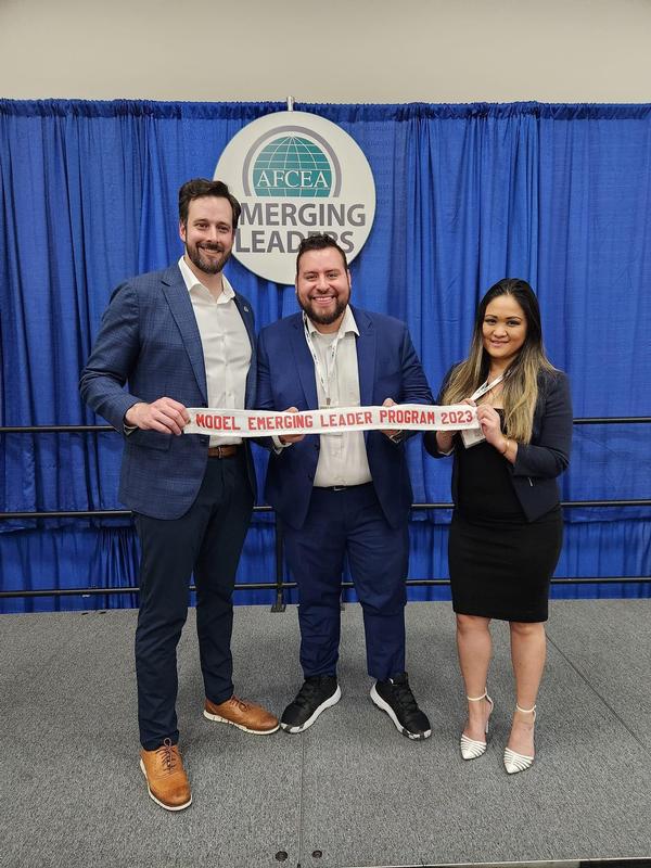 Outstanding Emerging Leader for 2024 Kevin Connors (l) is pictured with Belvoir Chapter Emerging Leaders President Carlos Embury (c) and Emerging Leaders Board Vice President Jen Acot during AFCEA's WEST conference in January.