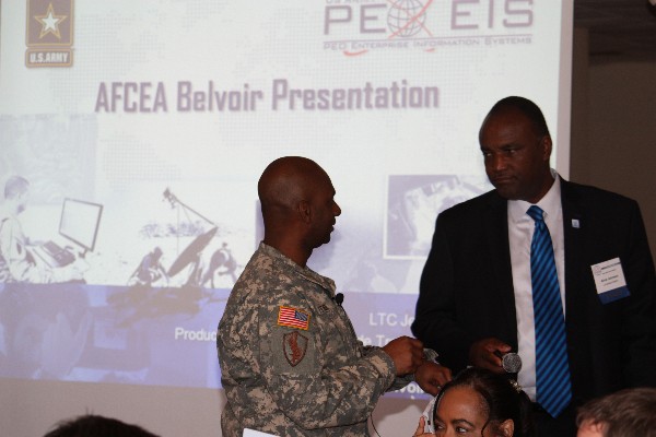 Alvie Johnson (r), executive vice president of the board, welcomes LTC Etienne to the November luncheon.