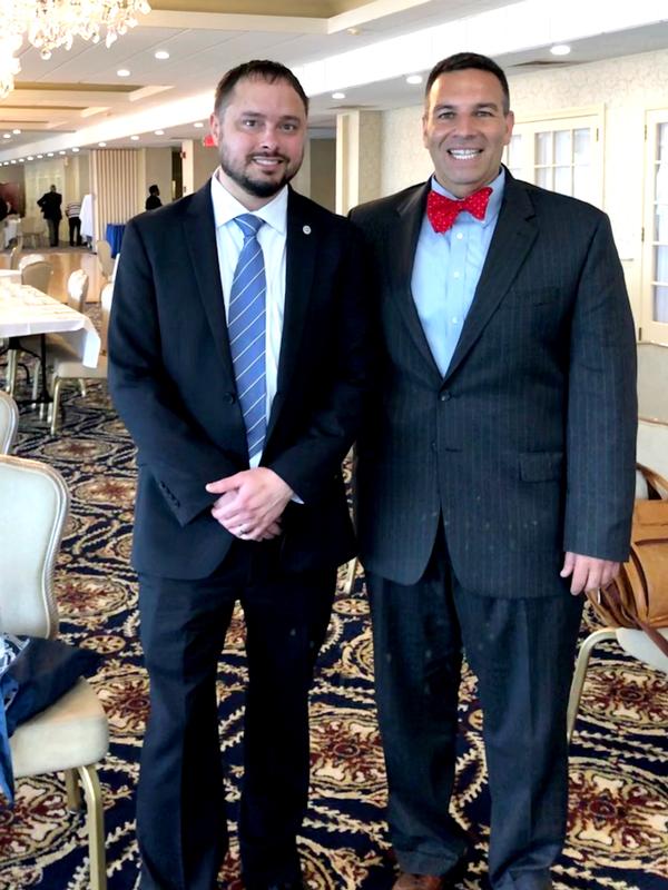 Hall and Strauss pause for a photo during the May event.