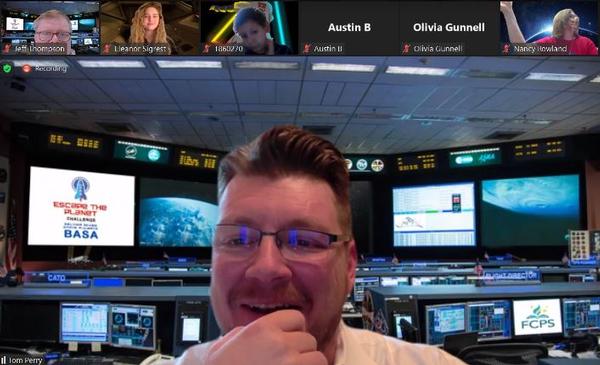 The Belvoir AFCEA Space Alliance director, played by Thomas Perry, AFCEA board member and president of VGSystems, presents the coding challenges and keeps the students mission-focused at the December event. 