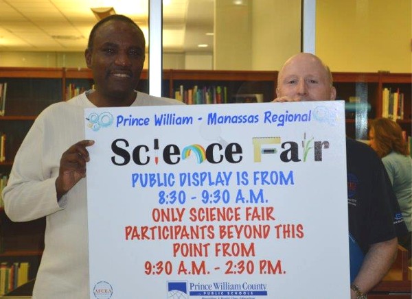 Alvie Johnson (l), chapter executive vice president, and Jones show their support for the Prince William County Science Fair in March.