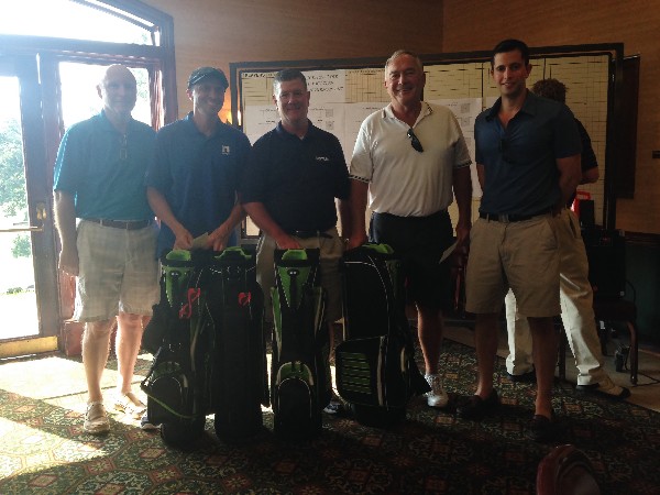 The second place team in the AFCEA Belvoir Education Golf Tournament in June stops for a photo.