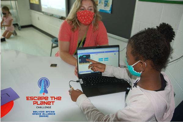 Students use Microbit devices in preparation for the December hackathon.