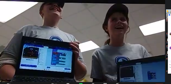 Students solve coding challenges at the December event.