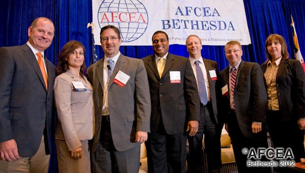 Panelists gathering at the chapter's September discussion on modular development are (l-r) Chris Dorobek, founder, editor and publisher, DorobekINSIDER; Daphne Zweifel, chapter president; Tim McCrosson, senior policy analyst, Office of E-Government and Information Technology, Office of Management and Budget; Shawn Kingsberry, assistant director of information technology and chief information officer, Recovery Accountability and Transparency Board; Mark Schwartz, chief information officer, U.S. Citizen and Immigration Services, Department of Homeland Security; Tom Sasala, chief technology officer, U.S. Army Information Technology Agency; and Dawn Hall, chapter vice president of breakfast programs.