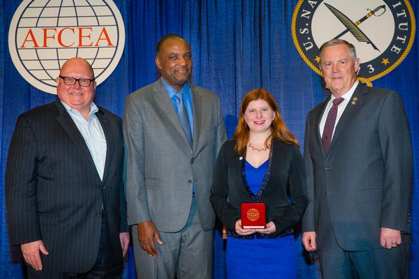 Sifer, with National Capital Region Regional Vice President Alvie Johnson (2nd from l) and Gen. Shea, honors Sarah Thayer, Young AFCEA Bethesda board member, with an AFCEA Distinguished Young AFCEAN Award in February.