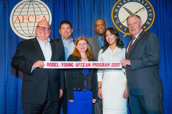 Sifer, Johnson and Gen. Shea present a banner in February to (from center l) Brad Barker, Young AFCEANs National Capital Region president, Thayer and Holland recognizing the chapter's award for Model Young AFCEAN Program.   

