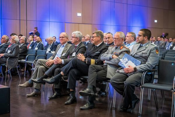 Visitors listen to the program of the 36th AFCEA Exhibition in Bonn, Germany, in May.