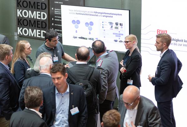 At the May event, an exhibition stand offers information on 