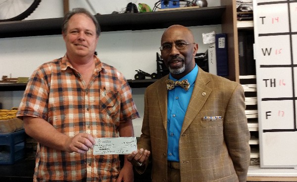 At the chapter's April luncheon, Kurt Schwartz, science teacher at High Tech High North County (l), accepts a $1,000 Science Teaching Tools grant from chapter officer Gerald Hampton.