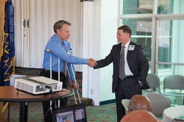 Witzel (l) thanks April luncheon guest speaker Bill Walker of Northrop Grumman following his presentation on the MQ-4C Triton unmanned aircraft system. 