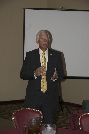 In June, Dave Grundies, regional vice president, highlights the chapter's achievements before presenting the 2009 Model Chapter banner.