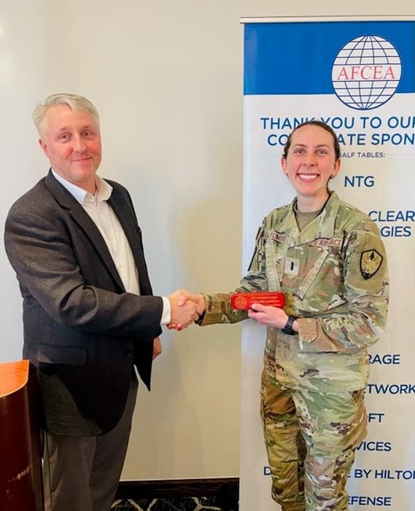 Leadership Award Winner Lt. Megan Getlinger, USAF, accepts her award at the March event.