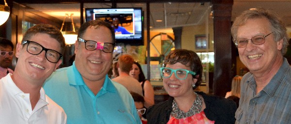 Wearing "geek gear" for the Geek Day social in July are (l-r) the chapter's Young AFCEAN (YAC) President, Rob Harrison; Chapter Executive Vice President Brian Cooper; YAC Social Lead Christina Bobb; and NiSUS Technologies President Joe Sperber.