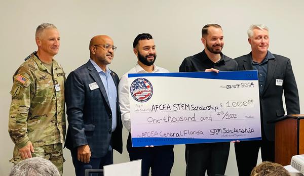 Pictured (l-r) are Col. Brian Kadet, chapter member at large; Eddie Peña, STEM scholarship chair; Saddy Bulla, student, University of South Florida; Christopher Stern, student, University of South Florida; and Joe Haulton, chapter first vice president.