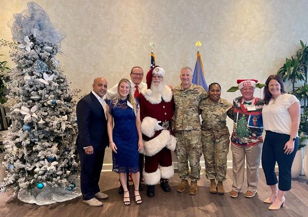 Chapter leadership poses with Santa at the chapter event in December.