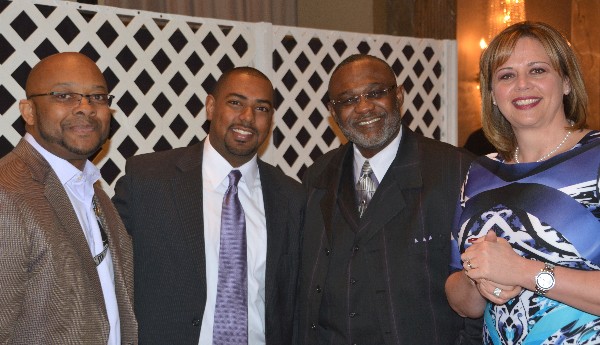 Together at the February luncheon are (l-r) George MacArthur, CACI; John Foster, chapter vice president of Young AFCEANs; an industry attendee; and Jennifer Kauffman, chapter board member.